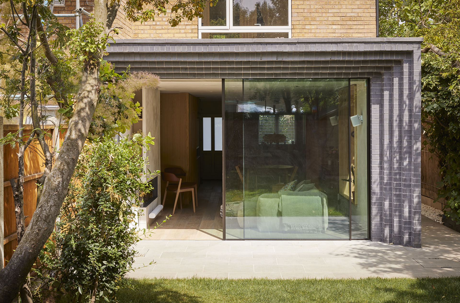 stepped Staffs blue brick extension to East London property by Lemos Architecture